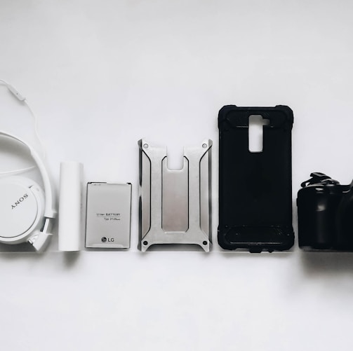 white Sony headphones and black smartphone case