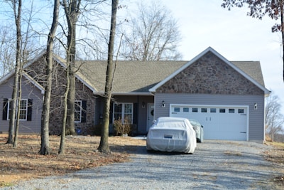 Finished front driveway with smooth concrete paving and neat edges beside a suburban home.