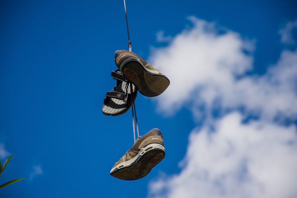 pair of brown sneakers in bokeh photography