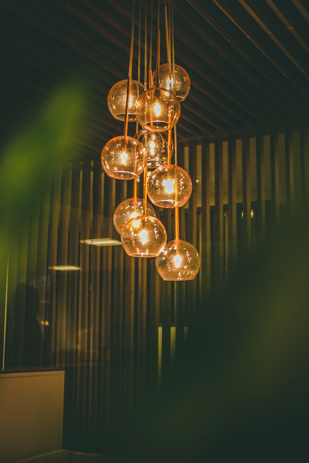 selective focus photography of lit pendant lights