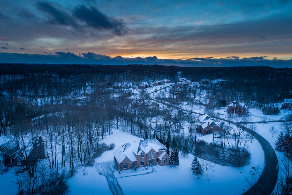 aerial photography of houses covered with snows