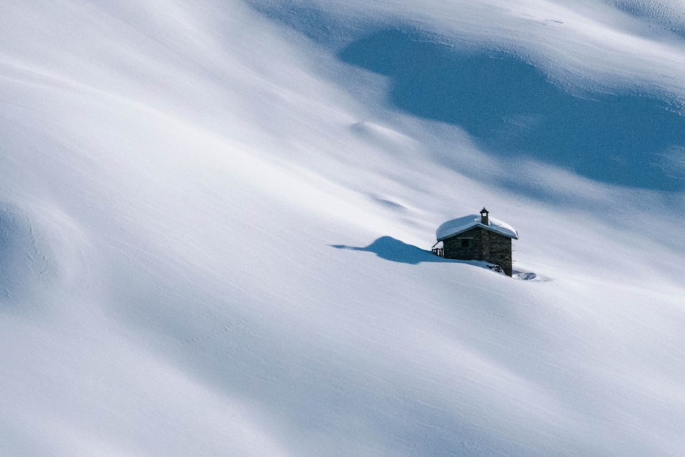 brown house covered by snow