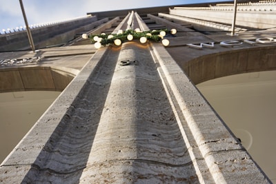 Close-up of architectural details on a contemporary structure’s facade, capturing texture and light.