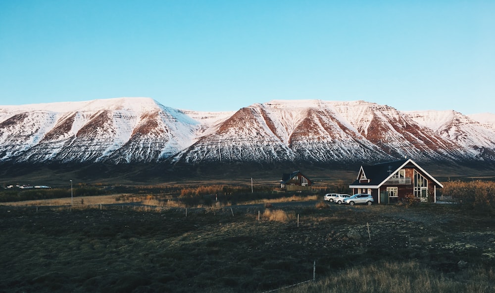 white and brown mountain near black house