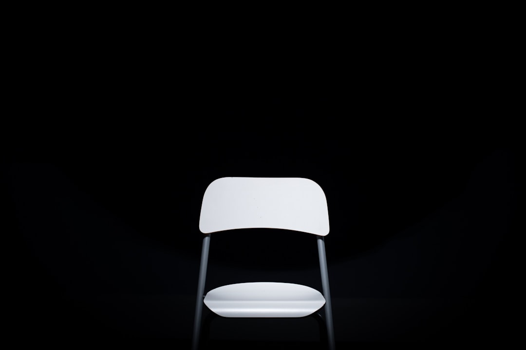 white and gray metal armless chair,