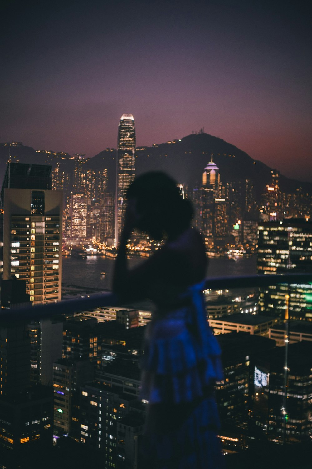 woman in backless top standing on veranda