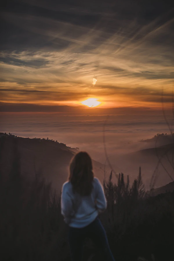 Watching the sunset from a hill