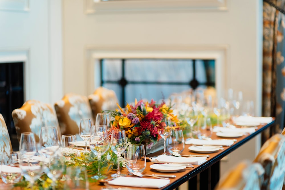 white ceramic plates on brown wooden table