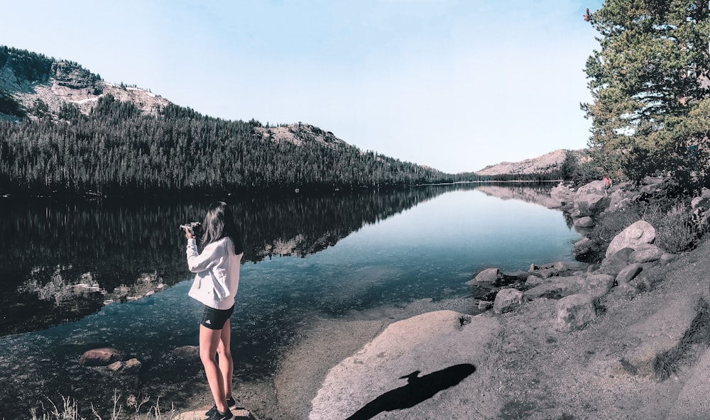 woman standing near river