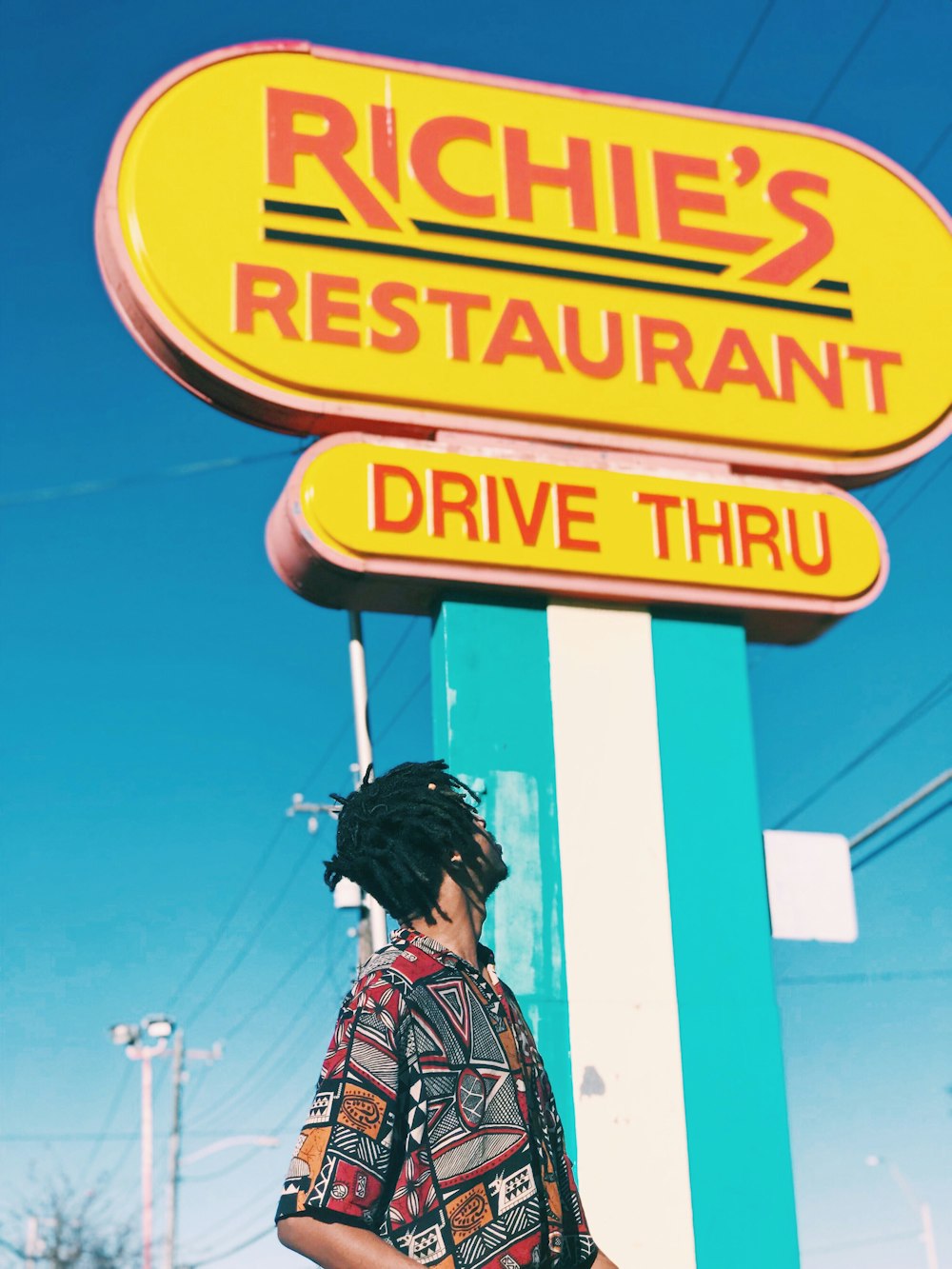 man looking on Richie's signage