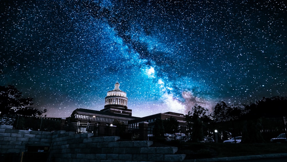 white and grey concrete building under starry night