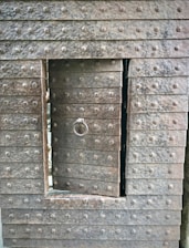 Close-up of a sturdy steel door with a sleek matte finish, showcasing precise welding and craftsmanship.