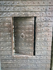 Close-up of a sturdy steel door with a textured finish, showcasing precise welding and craftsmanship.