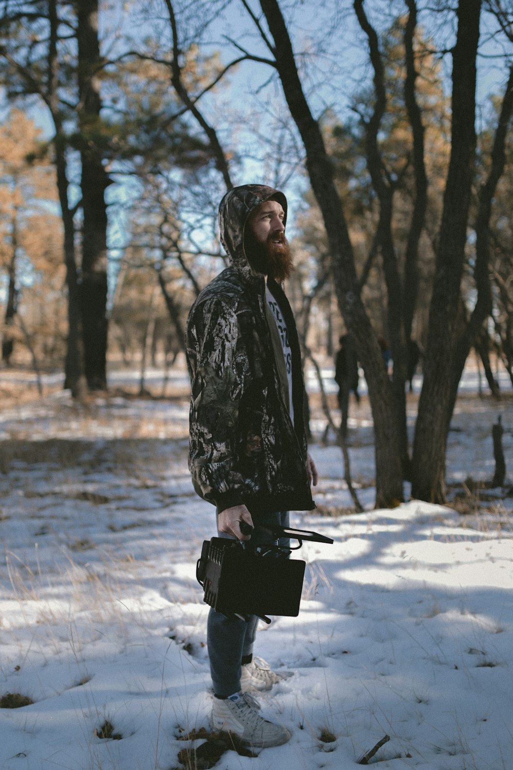 man standing on snow ground