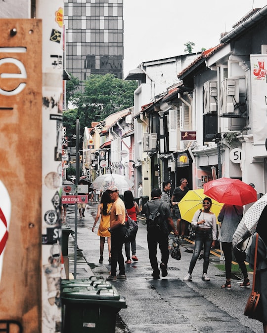 people using umbrella during daytime in Haji Lane Singapore