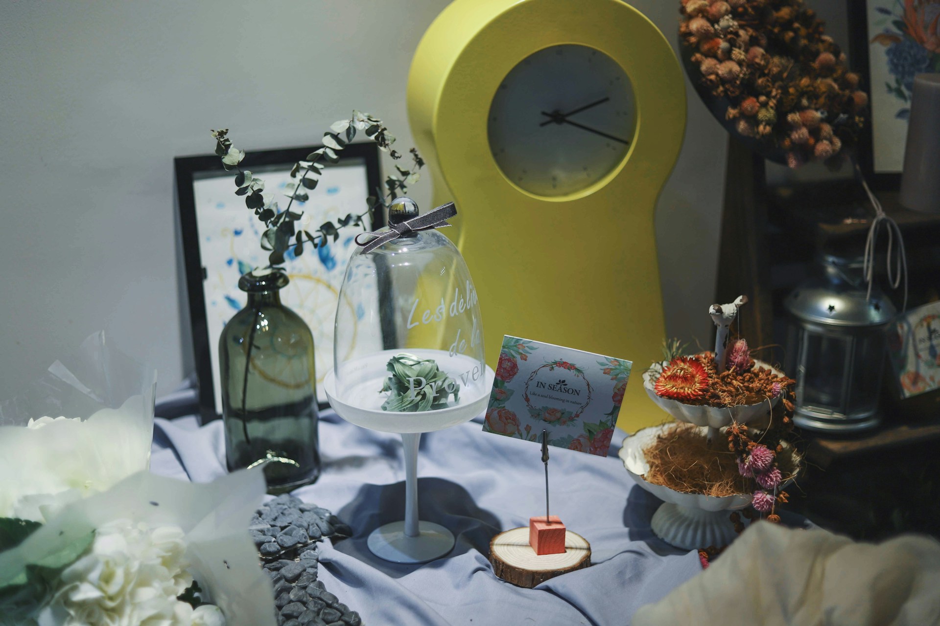 A beautifully arranged aesthetic home decor setup featuring sunflowers and creative trinkets.