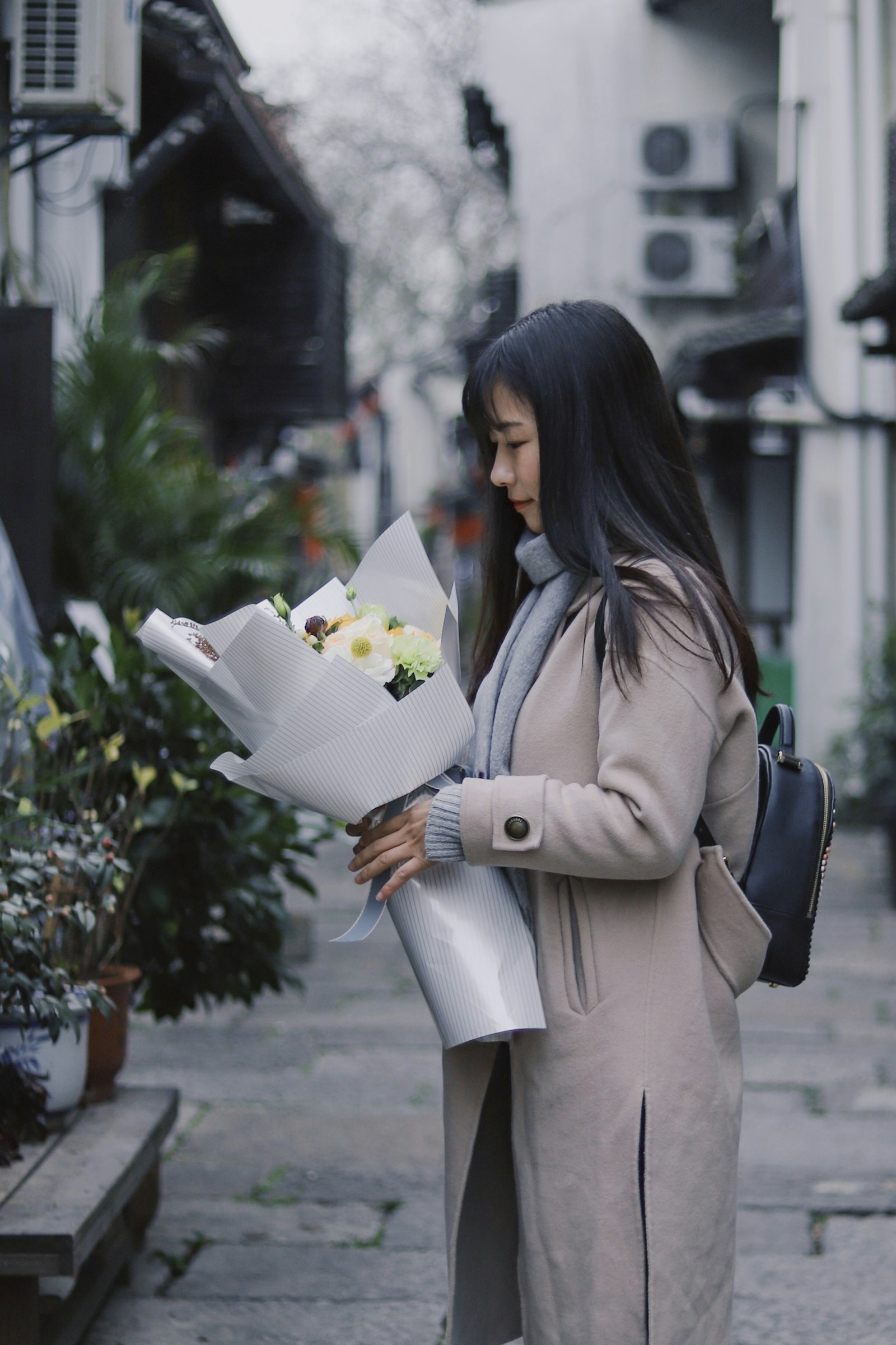 Canon EF 50mm F1.8 STM sample photo. Woman holding bouquet of photography