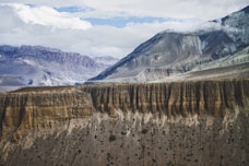 aerial photography of brown cliff near mountain