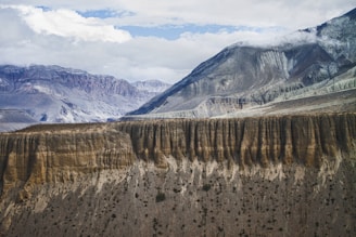 aerial photography of brown cliff near mountain