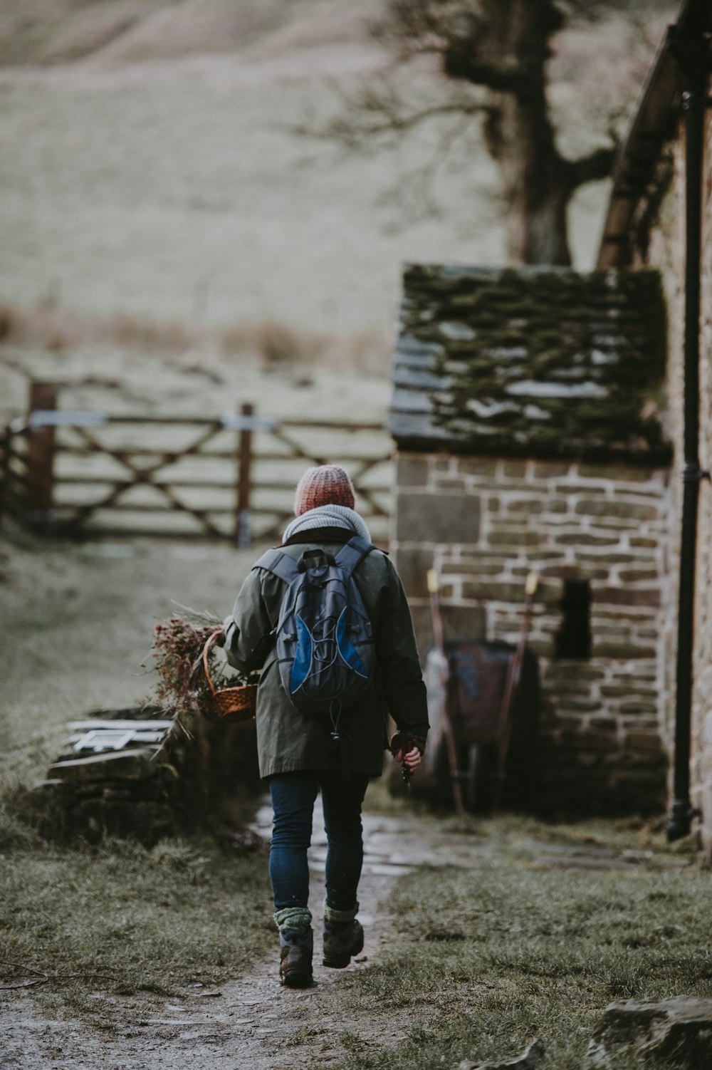 a person with a backpack walking down a path