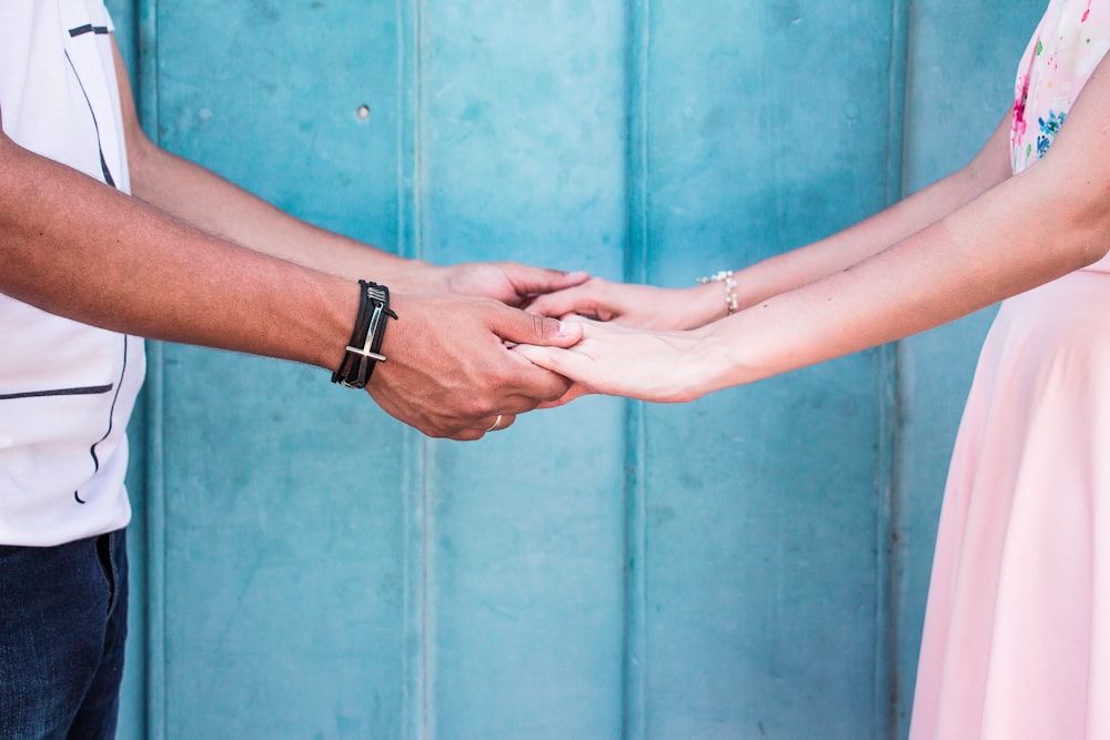 man and woman holding hands