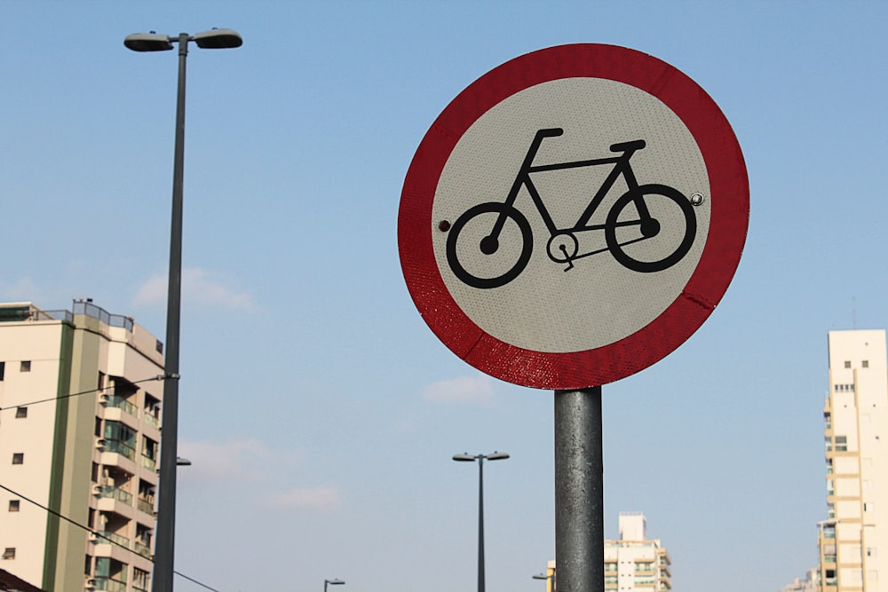 street sign near building under bue sky at daytime