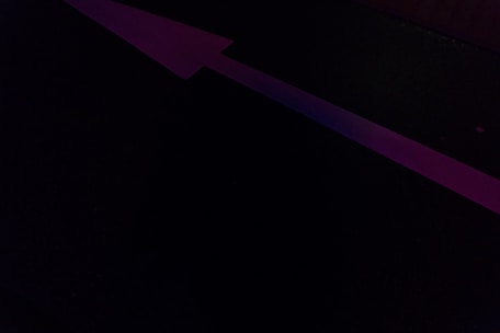 A sleek digital arrow pointing forward on a glowing blue background symbolizing fast navigation.