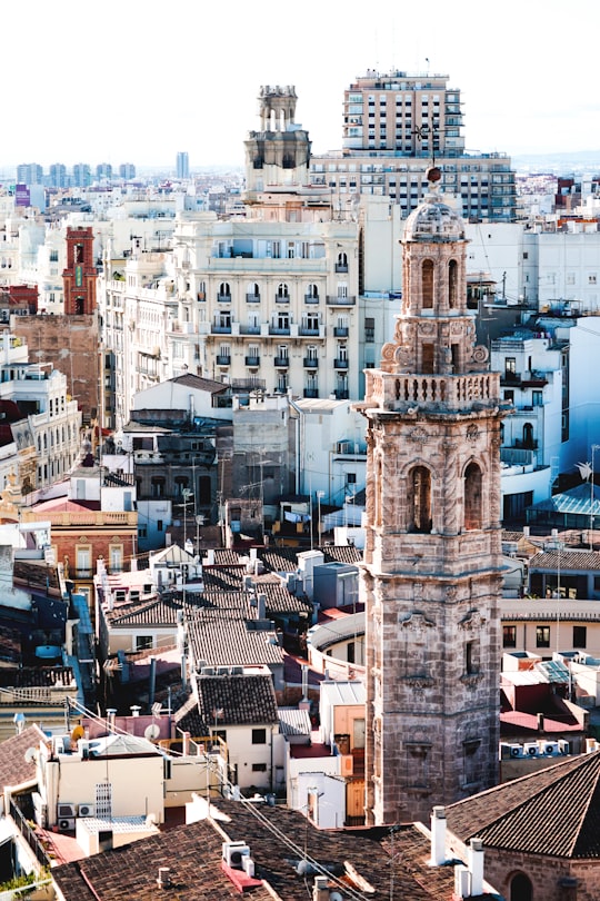 aerial photography of beige tower surrounded by houses during daytime in Plaza de la Reina Spain