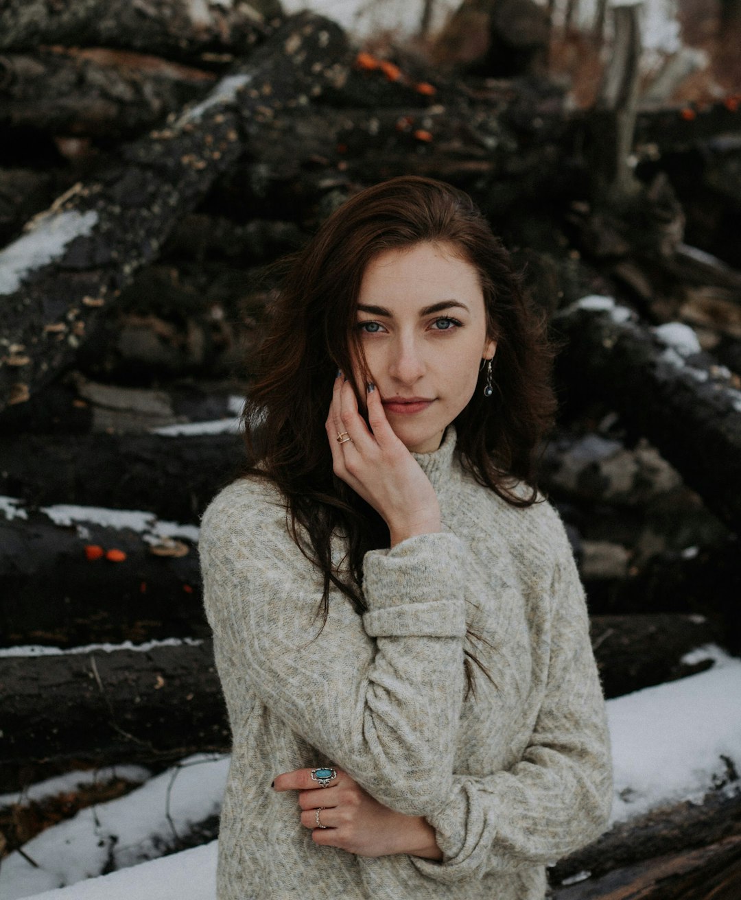 selective focus photography of woman in gray sweater