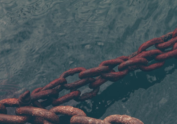 rusty chain on water