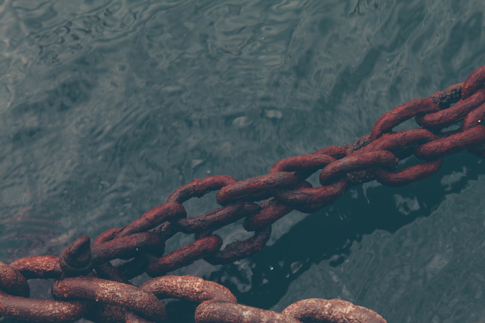 rusty chain on water