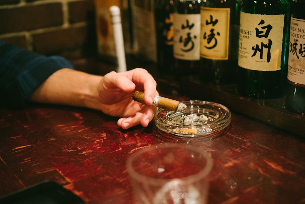 person holding cigar