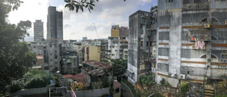 city buildings under cloudy sky
