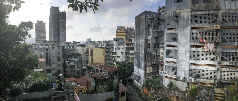 city buildings under cloudy sky