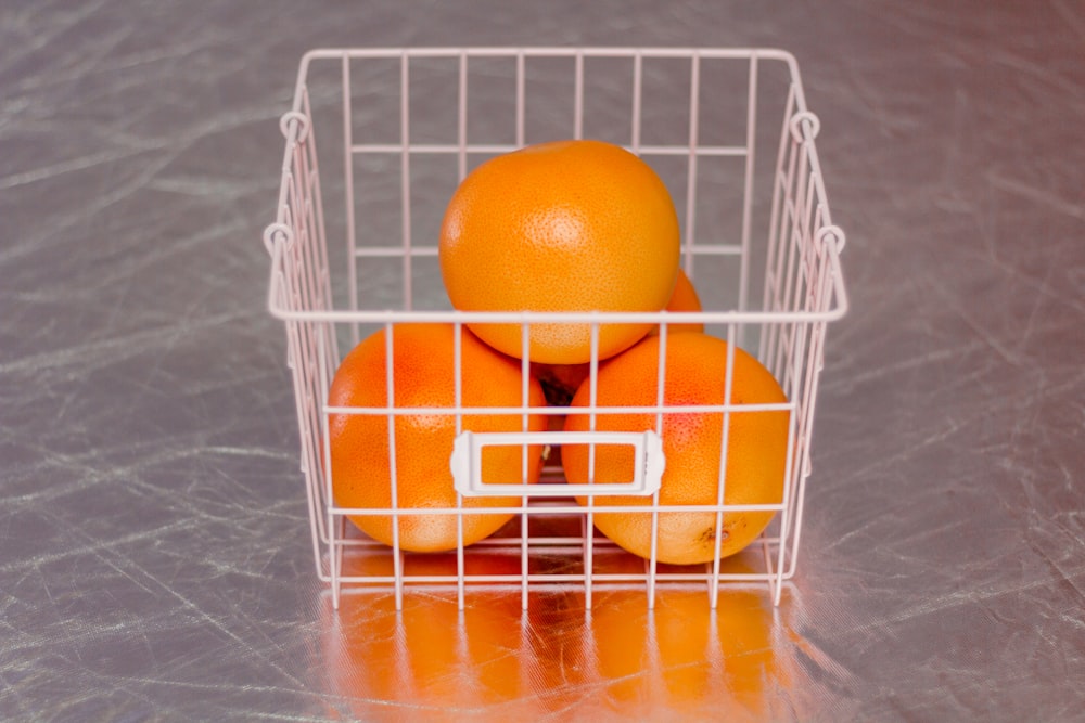 orange fruits on basket