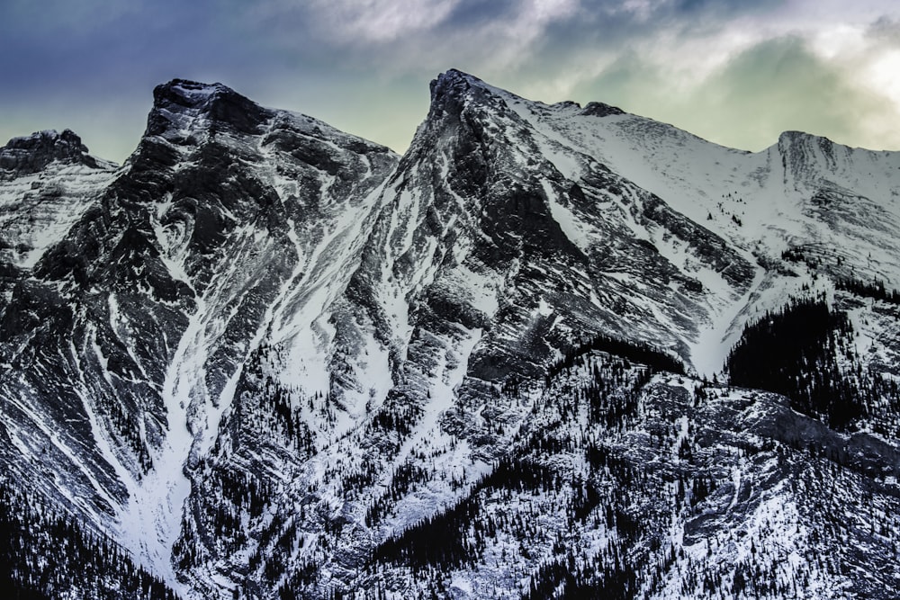 snow covered mountain under blue sky