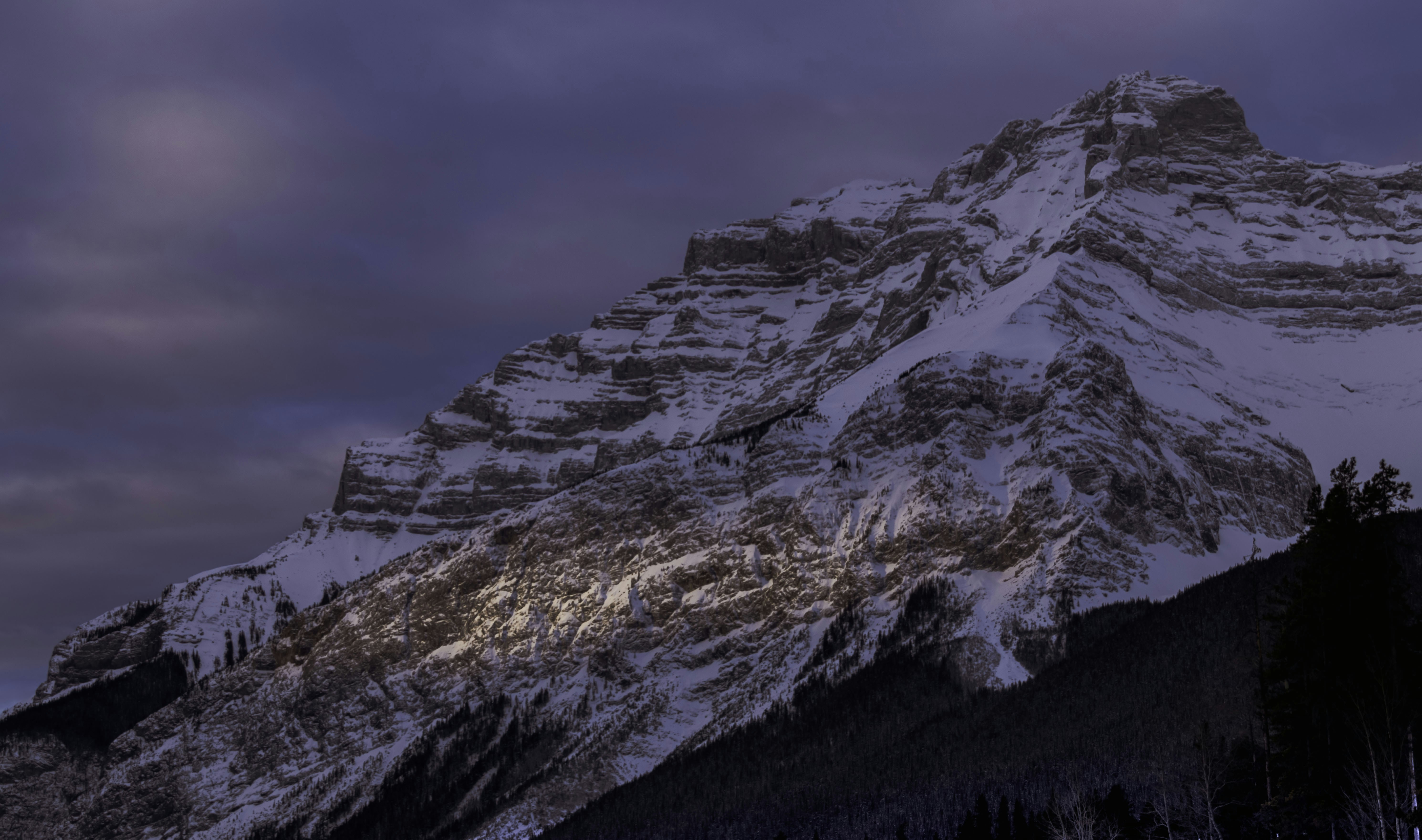 Sometimes, when you are surrounded by a collection of great shots, turning around and lookng up can give a whole new look to your surroundings. That’s what happened here! While my buddy Jeff and I were focused on the mountains directly ahead of us, I turned 180 degrees and saw the first sliver of sun hitting the mountain behind us. I quickly turned around to capture the moment, and it was moment because the sun disappeared very quickly… I think I was lucky.