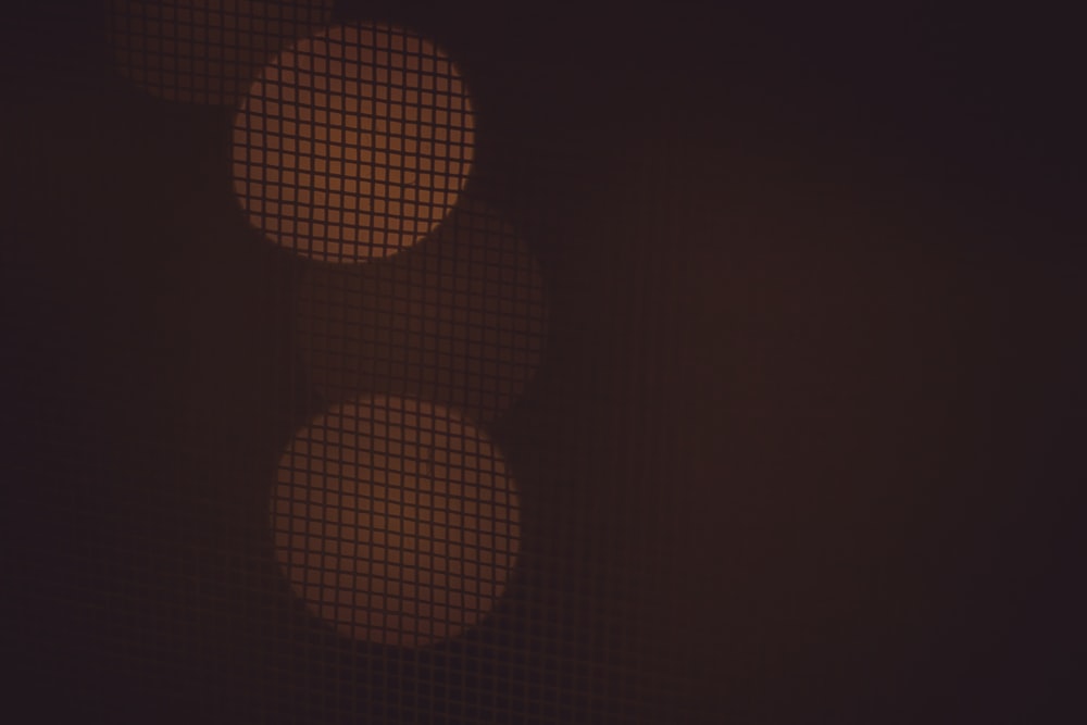 a close up of a traffic light in the dark