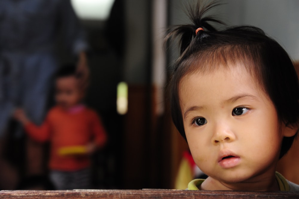 child wearing pink scrunchies