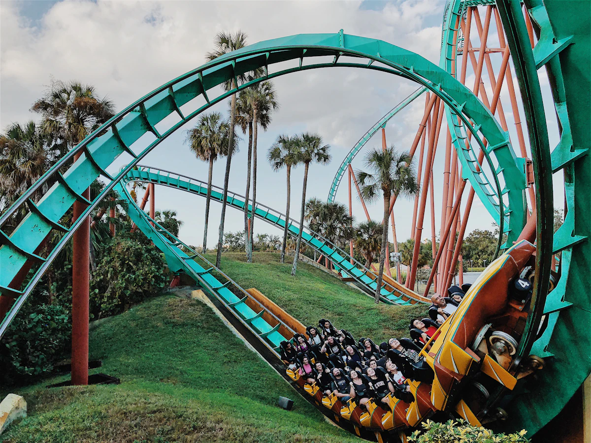 A steel roller coaster track curving against the sky
