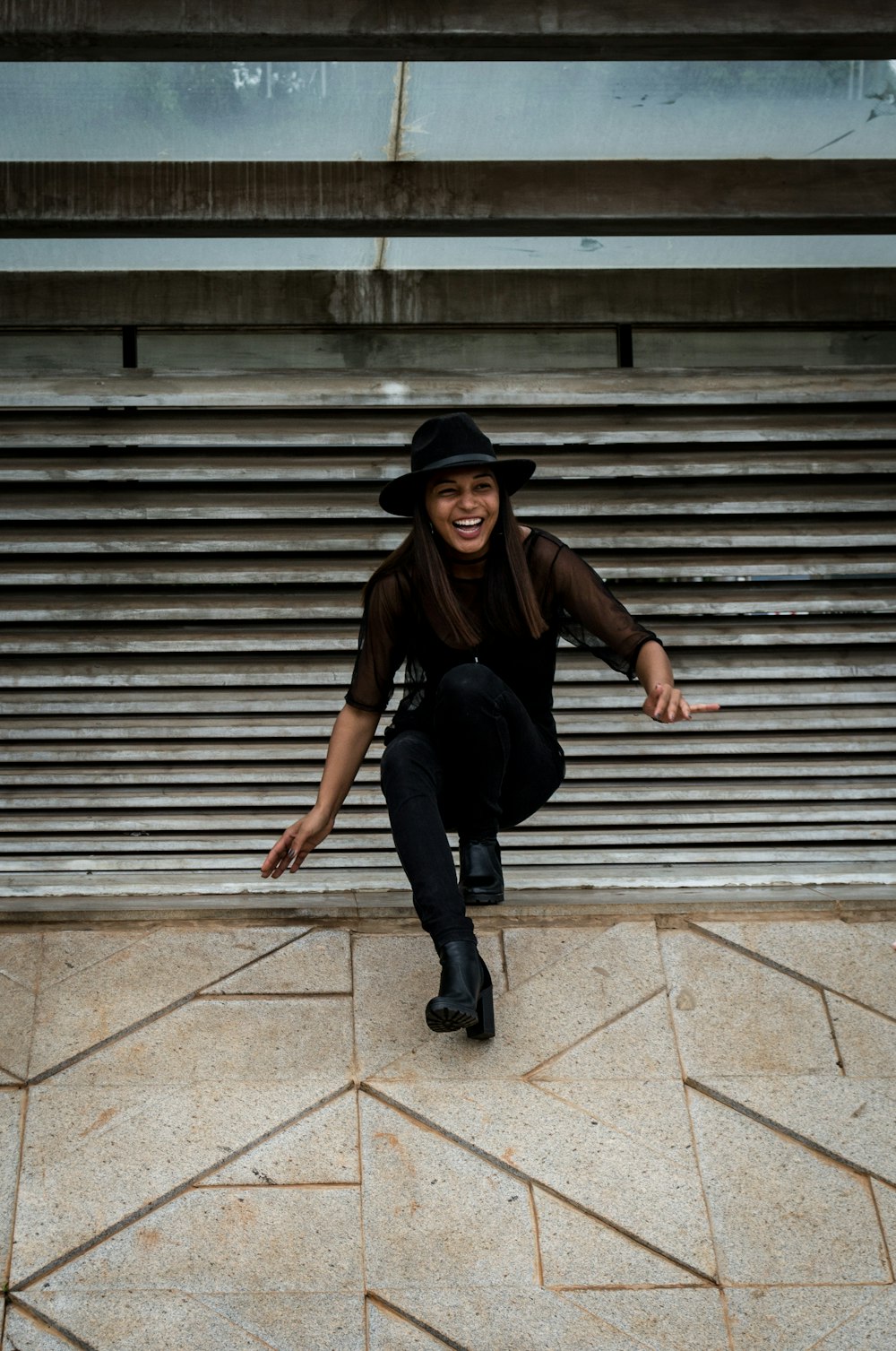 woman on gray steps outdoors