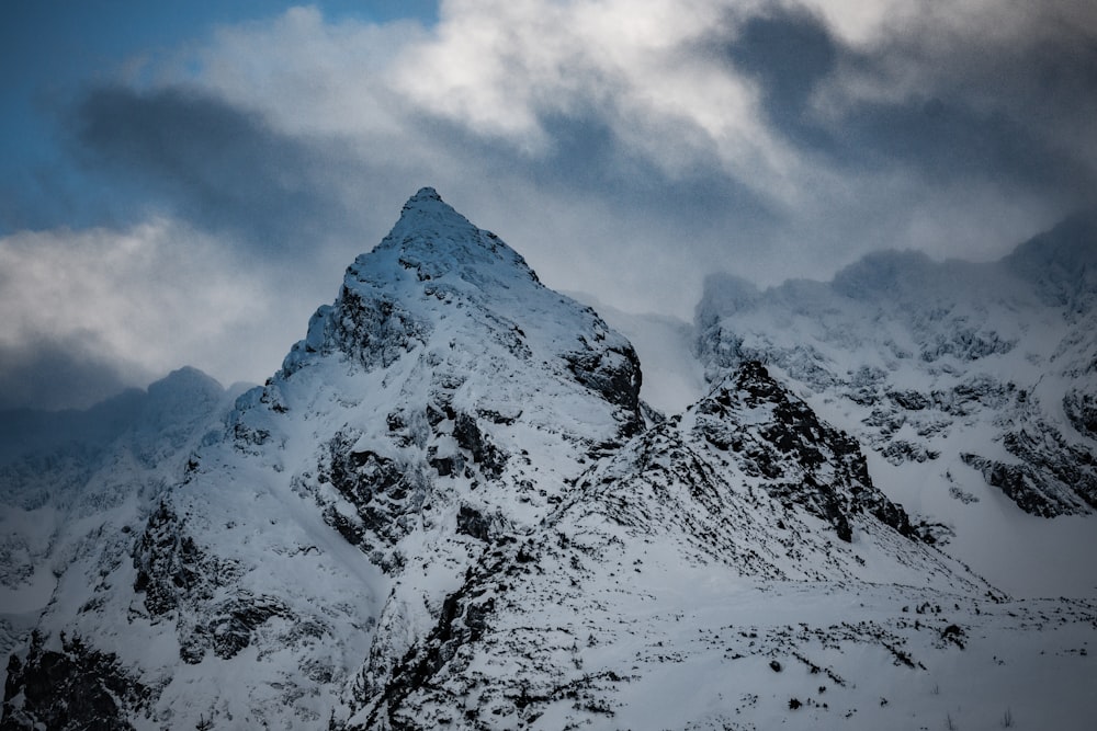 white and black mountain under blue sky