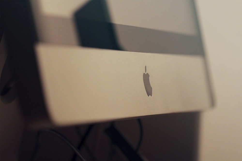 a close up of an apple product on a wall