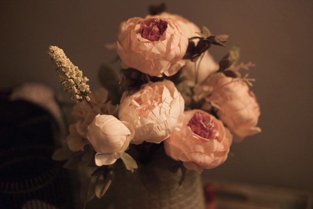 beige flower arrangement with pot