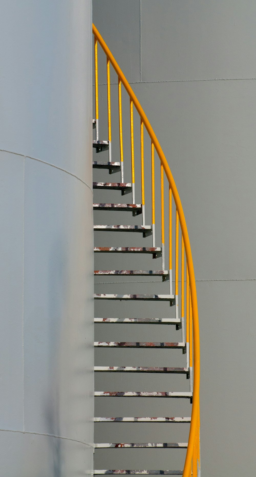 yellow and silver spiral staircase