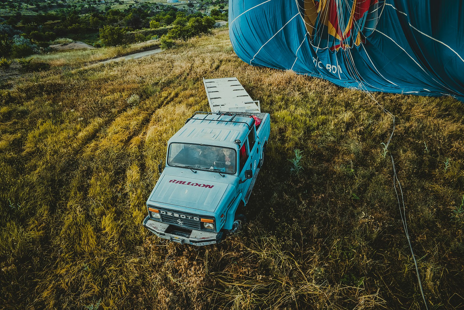 20mm F2.8 sample photo. Pickup truck beside textile photography