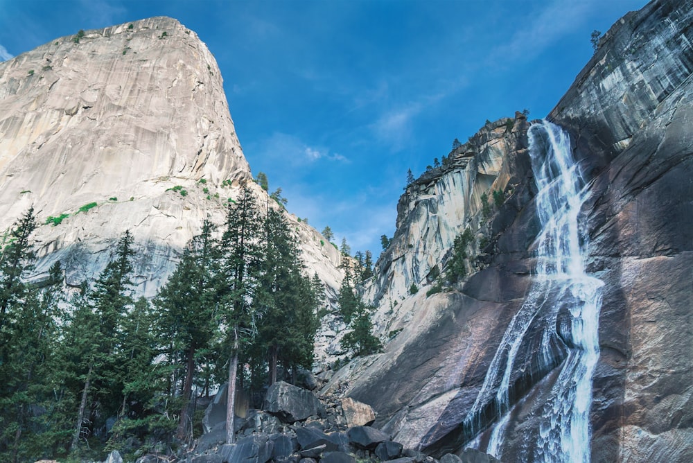 mountain with waterfalls during daytime