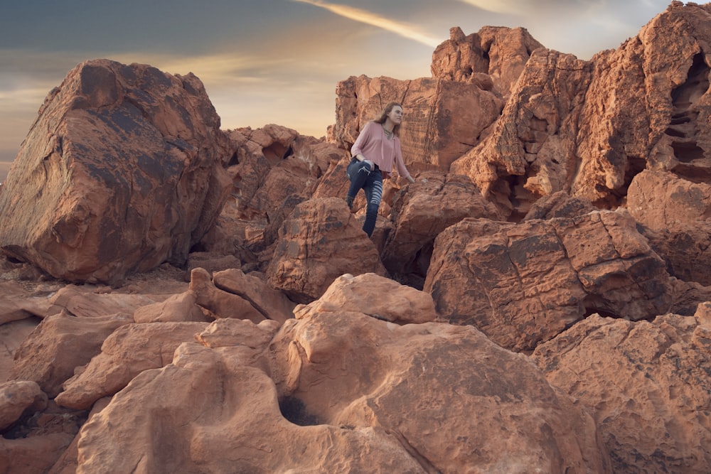 woman standing on rock during daytime