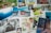 A collection of multiple photographs laid out together, including a wedding couple posing with a sports car, an underwater diver, a serene forest scene, and a family portrait in nature. Other images depict a couple cuddled close and a young child smiling at the camera.