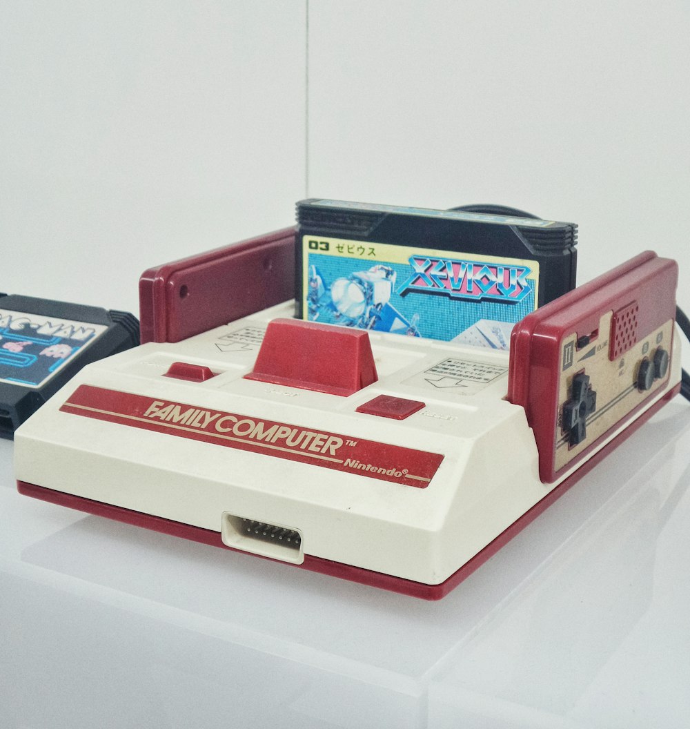red and white Nintendo Family Computer console